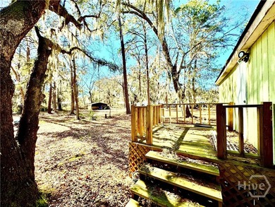 Sitting on a full acre with beautiful mature oaks, this home - photo 5