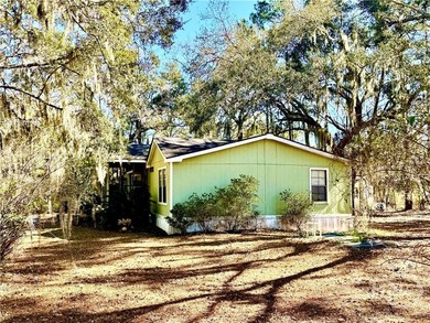Sitting on a full acre with beautiful mature oaks, this home - photo 7