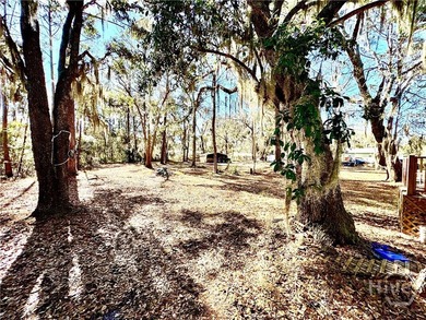 Sitting on a full acre with beautiful mature oaks, this home - photo 10