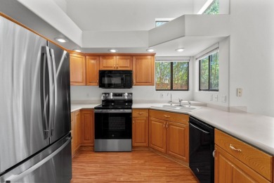 Open and airy with soaring vaulted ceilings throughout! Kitchen