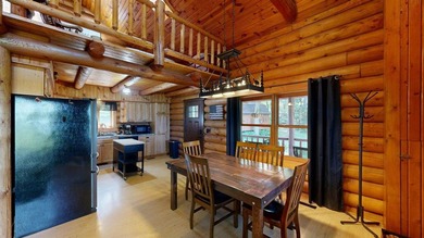 Escape to this cabin-style retreat with gorgeous river views and - photo 11