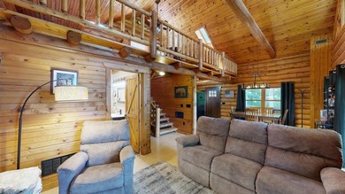 Escape to this cabin-style retreat with gorgeous river views and - photo 13