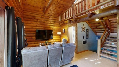 Escape to this cabin-style retreat with gorgeous river views and - photo 14
