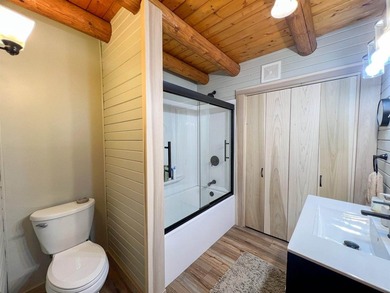 Escape to this cabin-style retreat with gorgeous river views and - photo 15