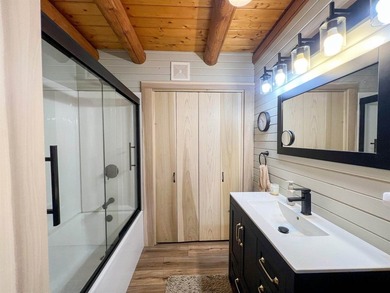 Escape to this cabin-style retreat with gorgeous river views and - photo 16