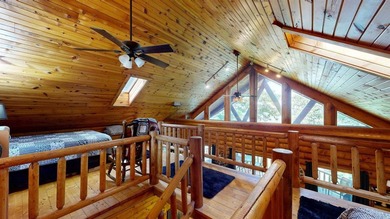 Escape to this cabin-style retreat with gorgeous river views and - photo 20