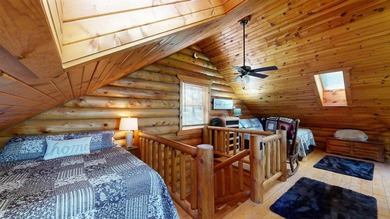 Escape to this cabin-style retreat with gorgeous river views and - photo 21
