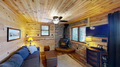 Escape to this cabin-style retreat with gorgeous river views and - photo 23