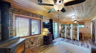 Escape to this cabin-style retreat with gorgeous river views and - photo 24