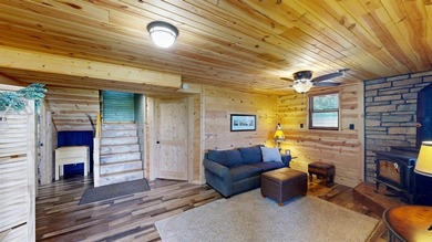 Escape to this cabin-style retreat with gorgeous river views and - photo 25