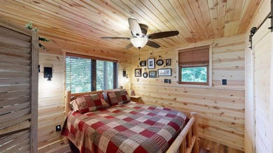 Escape to this cabin-style retreat with gorgeous river views and - photo 27