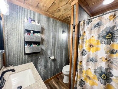Escape to this cabin-style retreat with gorgeous river views and - photo 32