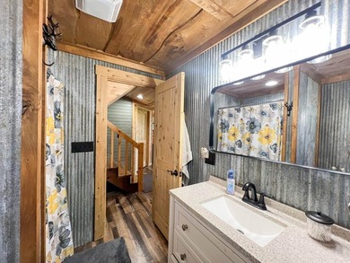 Escape to this cabin-style retreat with gorgeous river views and - photo 33