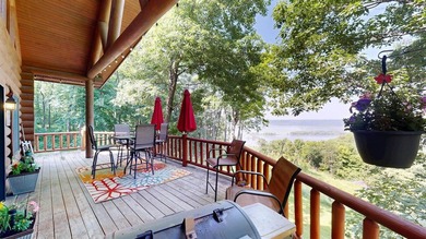 Escape to this cabin-style retreat with gorgeous river views and - photo 39