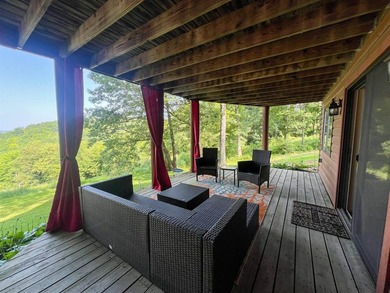 Escape to this cabin-style retreat with gorgeous river views and - photo 42