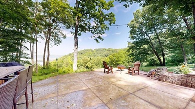 Escape to this cabin-style retreat with gorgeous river views and - photo 46