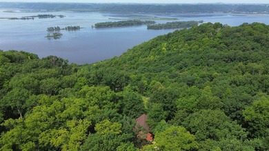 Escape to this cabin-style retreat with gorgeous river views and - photo 48