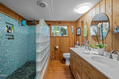 Welcome to a one-of-a-kind retreat nestled on 5.19 acres just