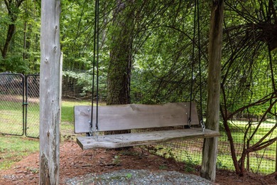 Welcome to a one-of-a-kind retreat nestled on 5.19 acres just