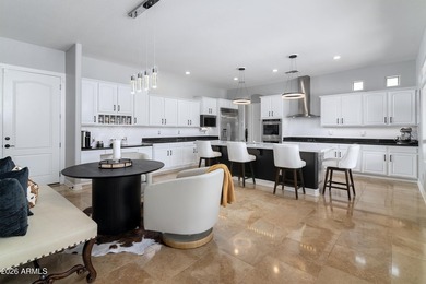 This exceptional home showcases a stunning open-concept design