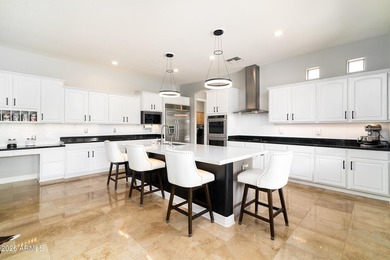 This exceptional home showcases a stunning open-concept design