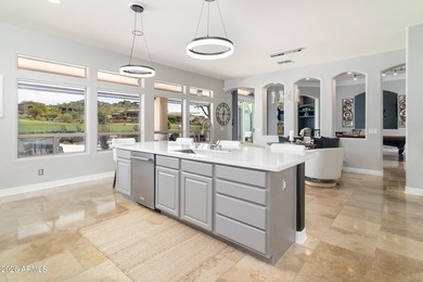 This exceptional home showcases a stunning open-concept design