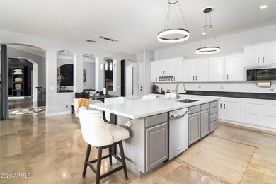 This exceptional home showcases a stunning open-concept design