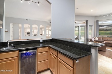 This exceptional home showcases a stunning open-concept design