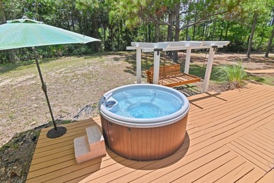 NO HOA AND OVER A HALF ACRE LOT! Bordered by lush vegetation and - photo 29