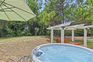 NO HOA AND OVER A HALF ACRE LOT! Bordered by lush vegetation and - photo 30