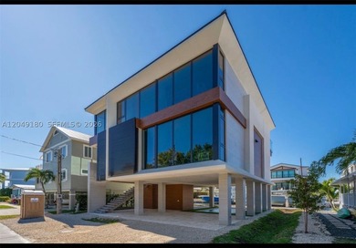 Experience the ultimate in modern waterfront luxury with this - photo 2