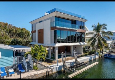Experience the ultimate in modern waterfront luxury with this - photo 3