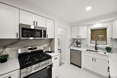 Welcome home to this beautifully updated three-bedroom, two - photo 18