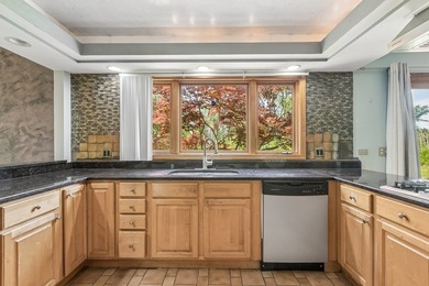 This contemporary 5-bedroom, 2.5-bath home sits on 1.4 wooded - photo 11