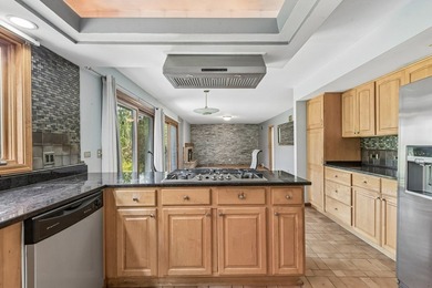 This contemporary 5-bedroom, 2.5-bath home sits on 1.4 wooded - photo 13