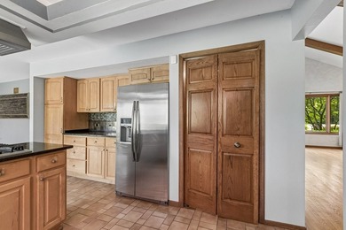 This contemporary 5-bedroom, 2.5-bath home sits on 1.4 wooded - photo 14