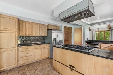 This contemporary 5-bedroom, 2.5-bath home sits on 1.4 wooded - photo 15