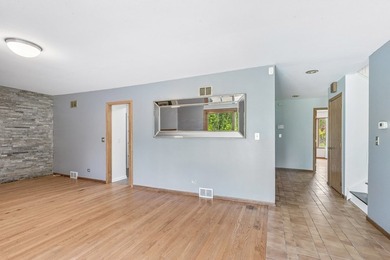 This contemporary 5-bedroom, 2.5-bath home sits on 1.4 wooded - photo 19