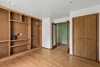 This contemporary 5-bedroom, 2.5-bath home sits on 1.4 wooded - photo 26