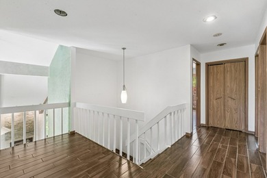 This contemporary 5-bedroom, 2.5-bath home sits on 1.4 wooded - photo 27