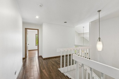 This contemporary 5-bedroom, 2.5-bath home sits on 1.4 wooded - photo 28