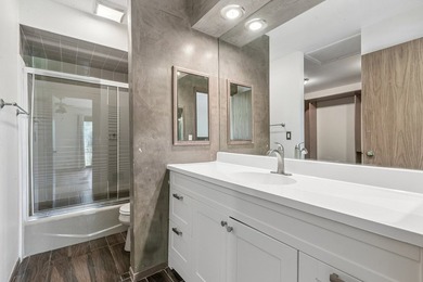 This contemporary 5-bedroom, 2.5-bath home sits on 1.4 wooded - photo 42