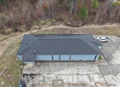 This versatile commercial property offers multiple office spaces