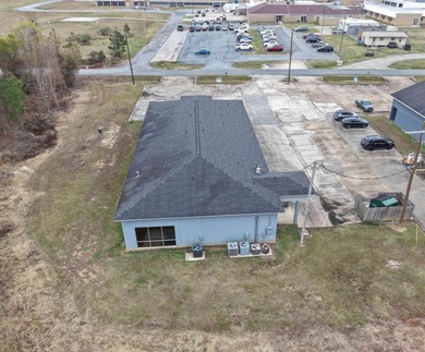 This versatile commercial property offers multiple office spaces