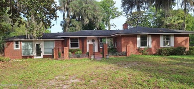 Lakefront views and exceptional privacy on a 1.4-acre lot can be - photo 1
