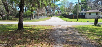 Lakefront views and exceptional privacy on a 1.4-acre lot can be - photo 3