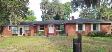 Lakefront views and exceptional privacy on a 1.4-acre lot can be - photo 5