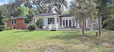 Lakefront views and exceptional privacy on a 1.4-acre lot can be - photo 8