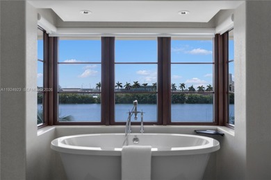 Experience luxury living in this exquisite 3-story waterfront