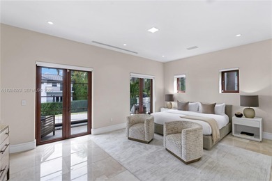 Experience luxury living in this exquisite 3-story waterfront